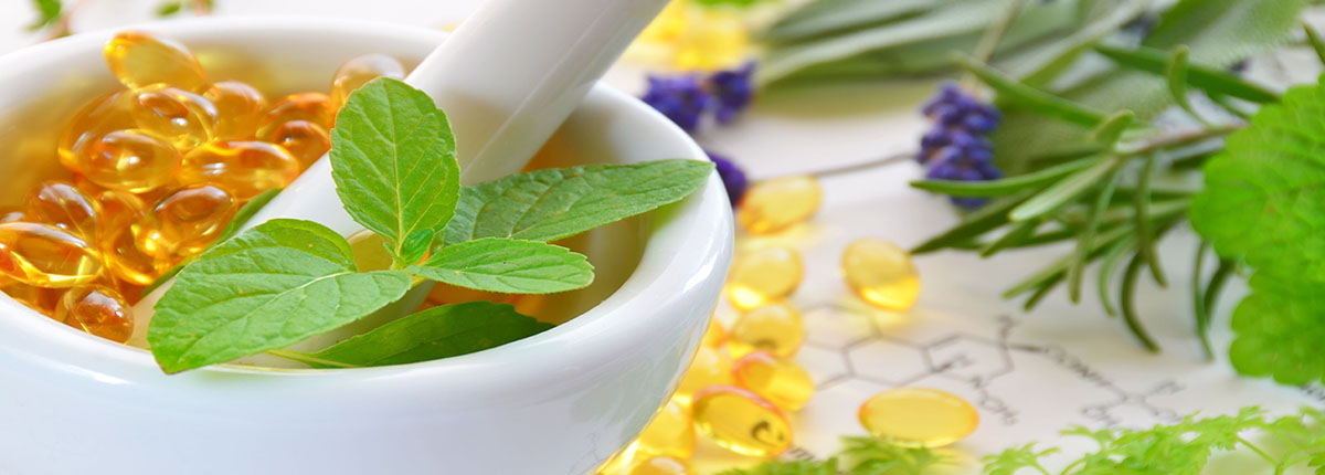 Mortar and pestle with natural supplements and plants