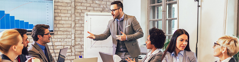 Business people engaged in a presentation and discussions