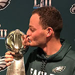 Rutgers Turf alumnus Conor Geisel Kissing the Vince Lombardi Trophy