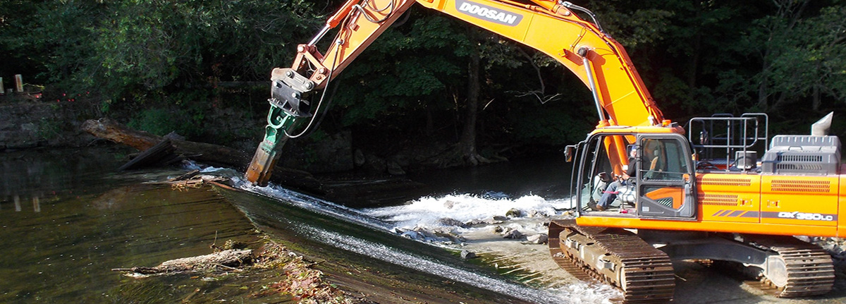 Construction vehicle removing Hughesville Dam on Musconetcong River