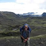Instructor Daniel Nachman hiking through mountainous area