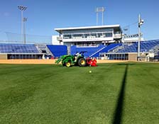 Rutgers Turf alumnus Eric Harshman working on a baseball field at the University of Kentucky