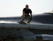 Eric Harshman on wing of fighter jet