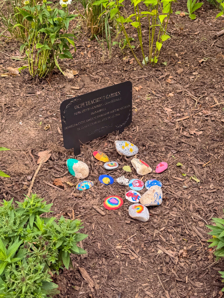 OCPE Teaching Garden sign and memorial rocks
