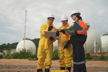 Environmental professionals take samples to test for contamination at a site.