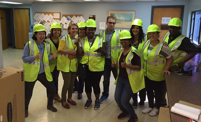 EPH students in hard hats and safety vests stop for a photo during their tour of the Morris County Transfer Station