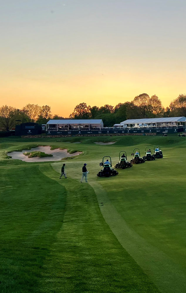 Greenskeepers mowing 18 fairway after practice rounds at the 2022 Wells Fargo Championship