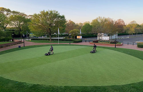 Greens Keepers Mowing Greens on the Black Course at Bethpage