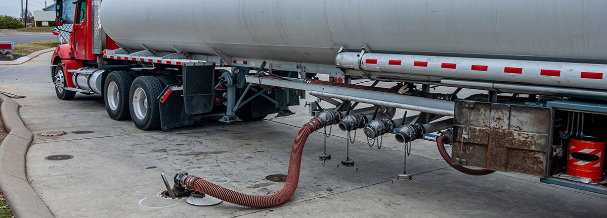 Fuel truck filling an underground storage tank