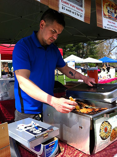 Nick DeStefano checking the temperature of ready-to-eat food at the Rutgers Farmers Market