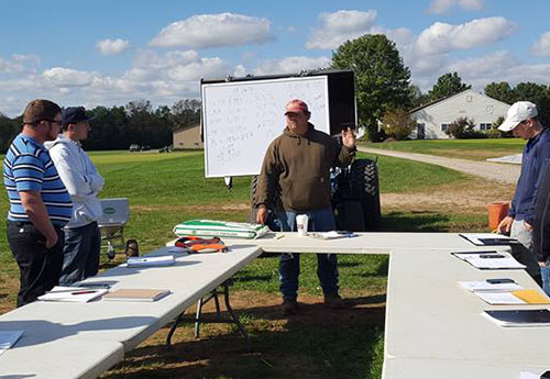 Rutgers Turf instructor Joe Clark teaching a Pesticide Calibration lesson