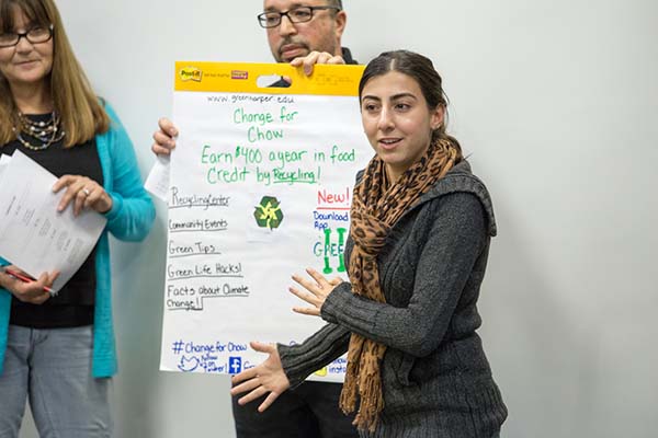 A student presents a poster during the Improving Your Public Communication Skills class
