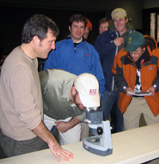Rutgers Turf instructor Rich Buckley with turf students using microscope