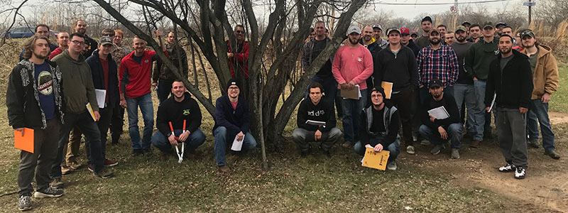 Turf students pose for a group shot after a hands-on pruning class