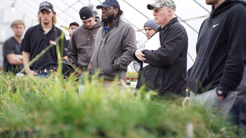 Turf students attending class in the greenhouse