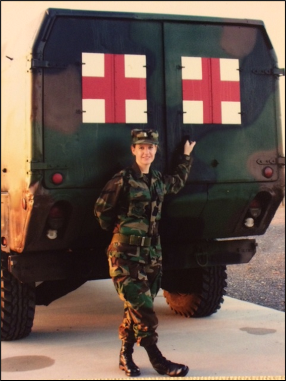 Virginia Wheatley in Airforce uniform standing in front of truck