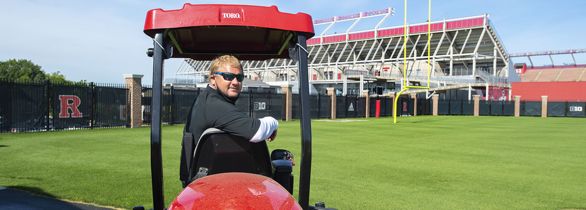 Turf management specialist Matt Henn prepares practice fields for Rutgers football team