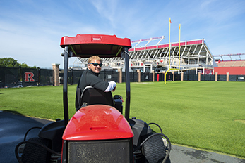 Turf management specialist Matt Henn prepares practice fields for Rutgers football team