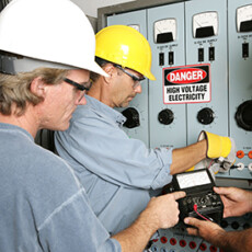 <a href="/electrical">Electrical</a> Electricians test voltage at a power center