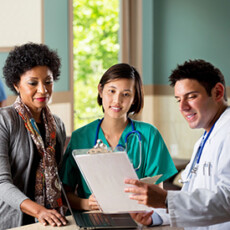<a href="/healthcare">Healthcare</a> Doctor showing chart to nurse and patient