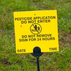 <a href="/pesticide-application">Pesticide Application</a> Yellow pesticide application sign on grass