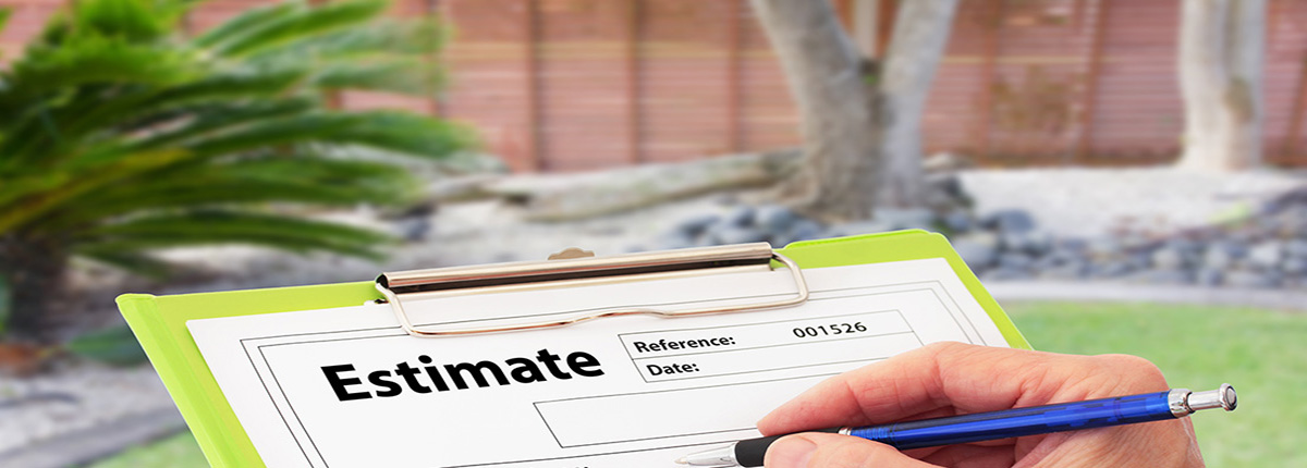 Clipboard holding Estimate sheet with landscaped garden in the background