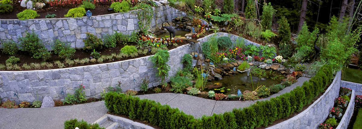 Beautifully landscaped retaining walls in a backyard garden