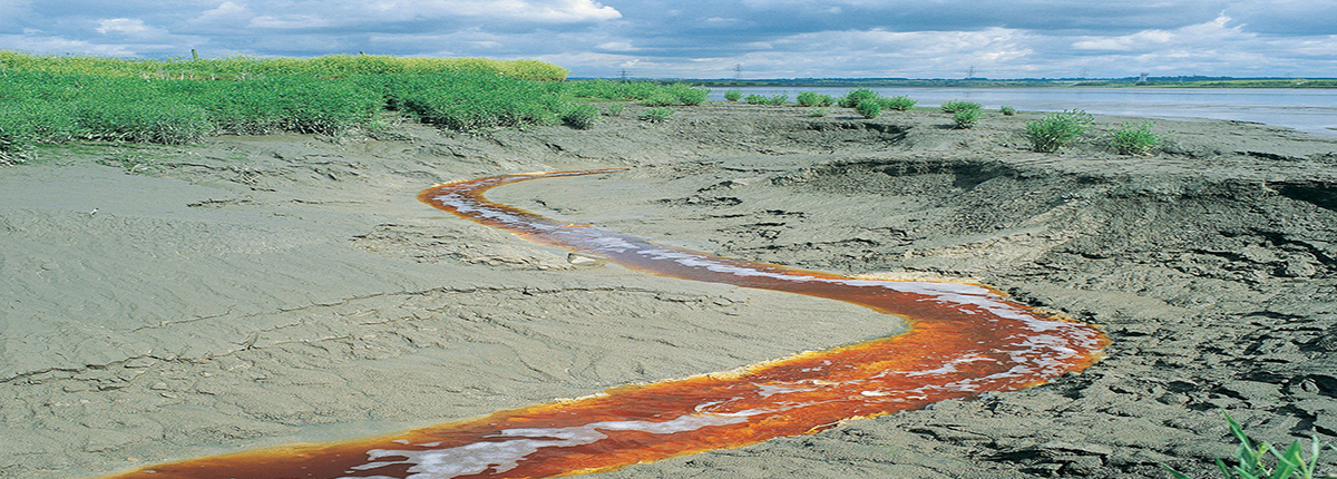 Brown discharge flowing toward river