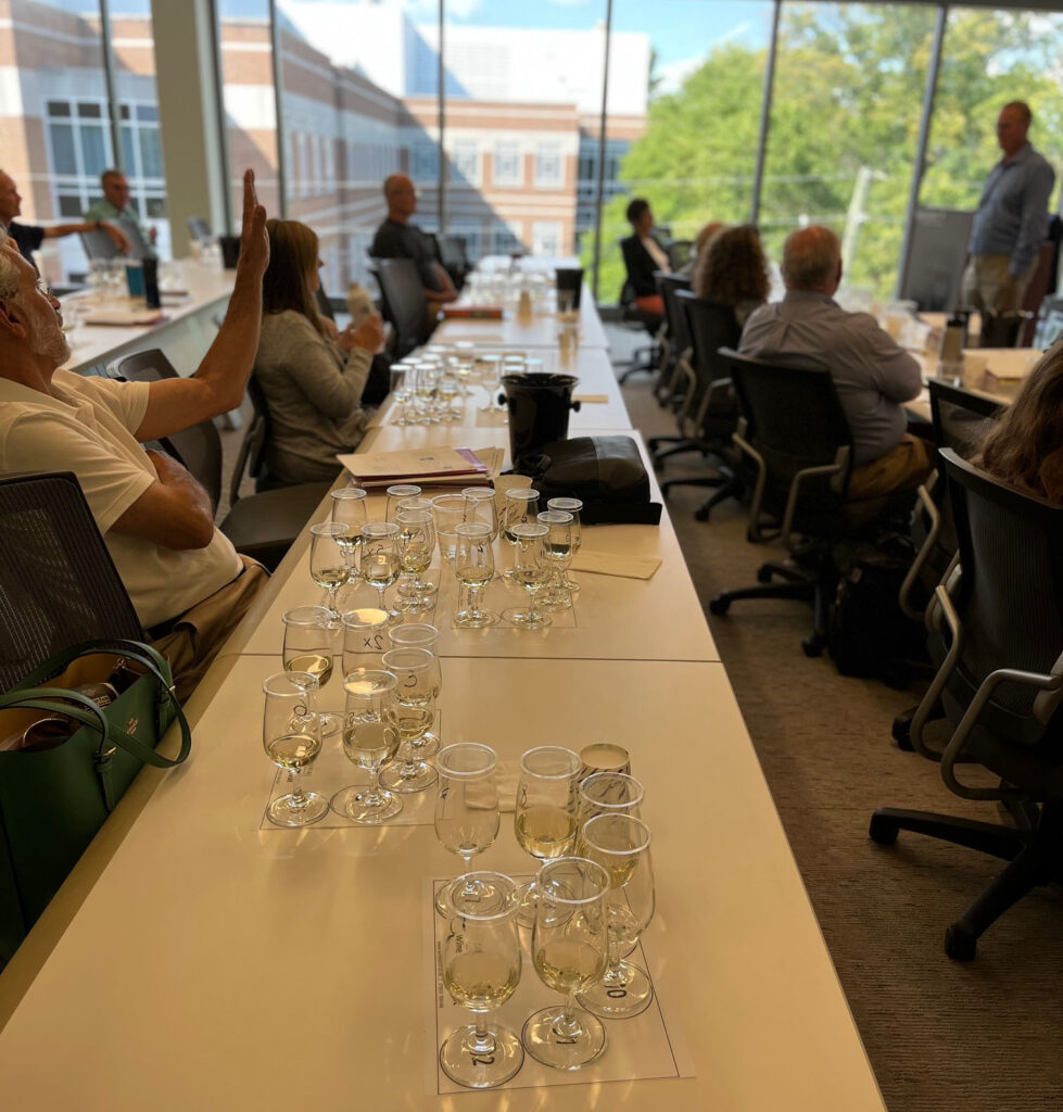 Grape and Wine Science students in the classroom with wine glasses in front of them