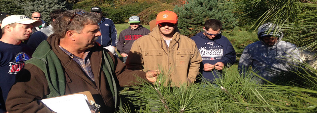 Instructor Steve Kristoph teaches a hands on plant identification session in the Rutgers Gardens