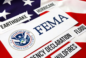FEMA related words like earthquake and flood with over American flag background