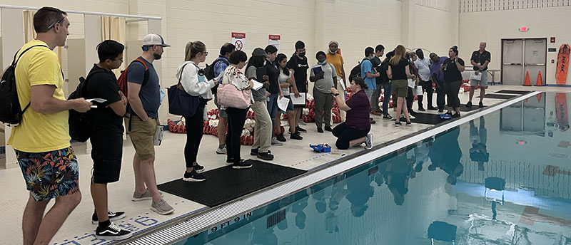 EPH students learning pool inspection techniques at Rutgers pool