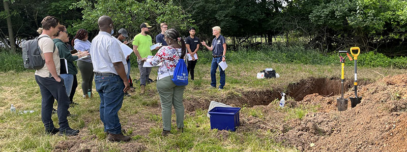 EPH students participate in a hands-on soil pit exercise
