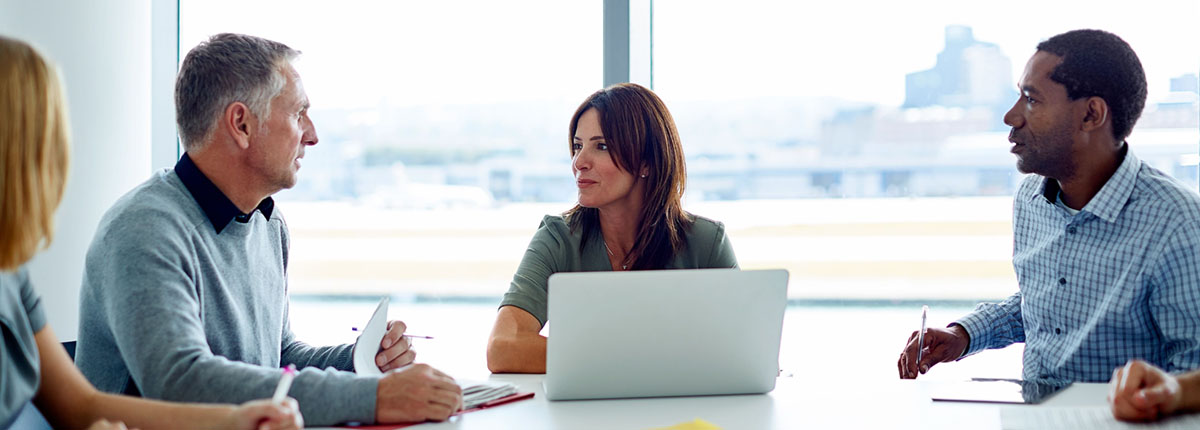 Diverse group of professionals meeting to discuss succession planning