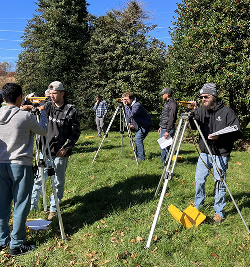 Turf students practice surveying in Rutgers Gardens