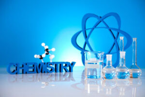 Chemistry concept with atomic model and vials of liquid