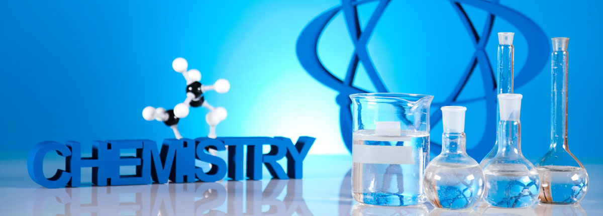 Chemistry concept with atomic model and vials of liquid